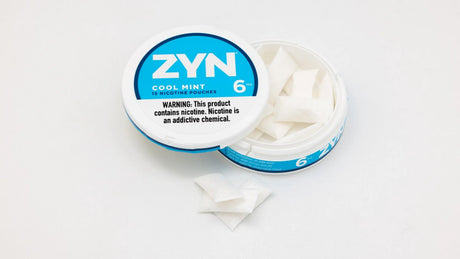 Open ZYN Cool Mint nicotine pouch can showing tobacco free nicotine pouches